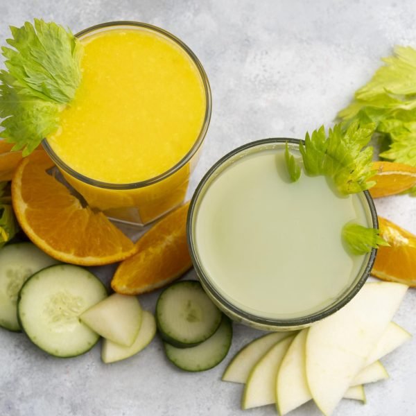 top-view-green-orange-juices
